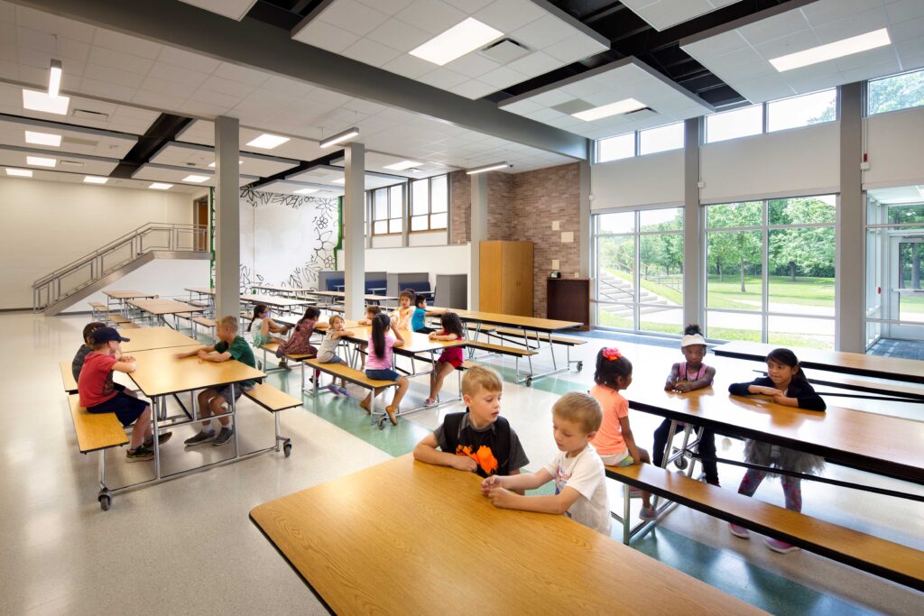 Sullivan Elementary School cafeteria with staircase and view of exterior stairs