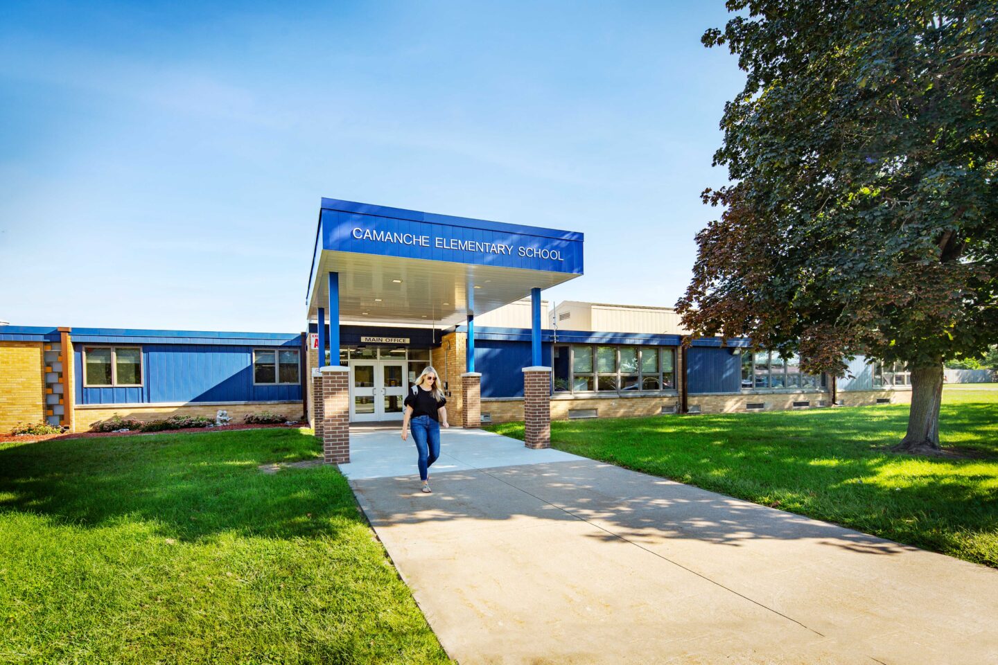 Camanche Elementary Front Entrance with a person walking out of the school