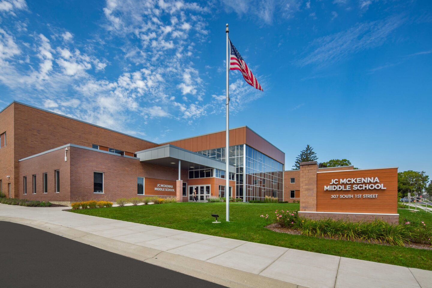 JC McKenna Middle School front of building - main entrance with flag pole