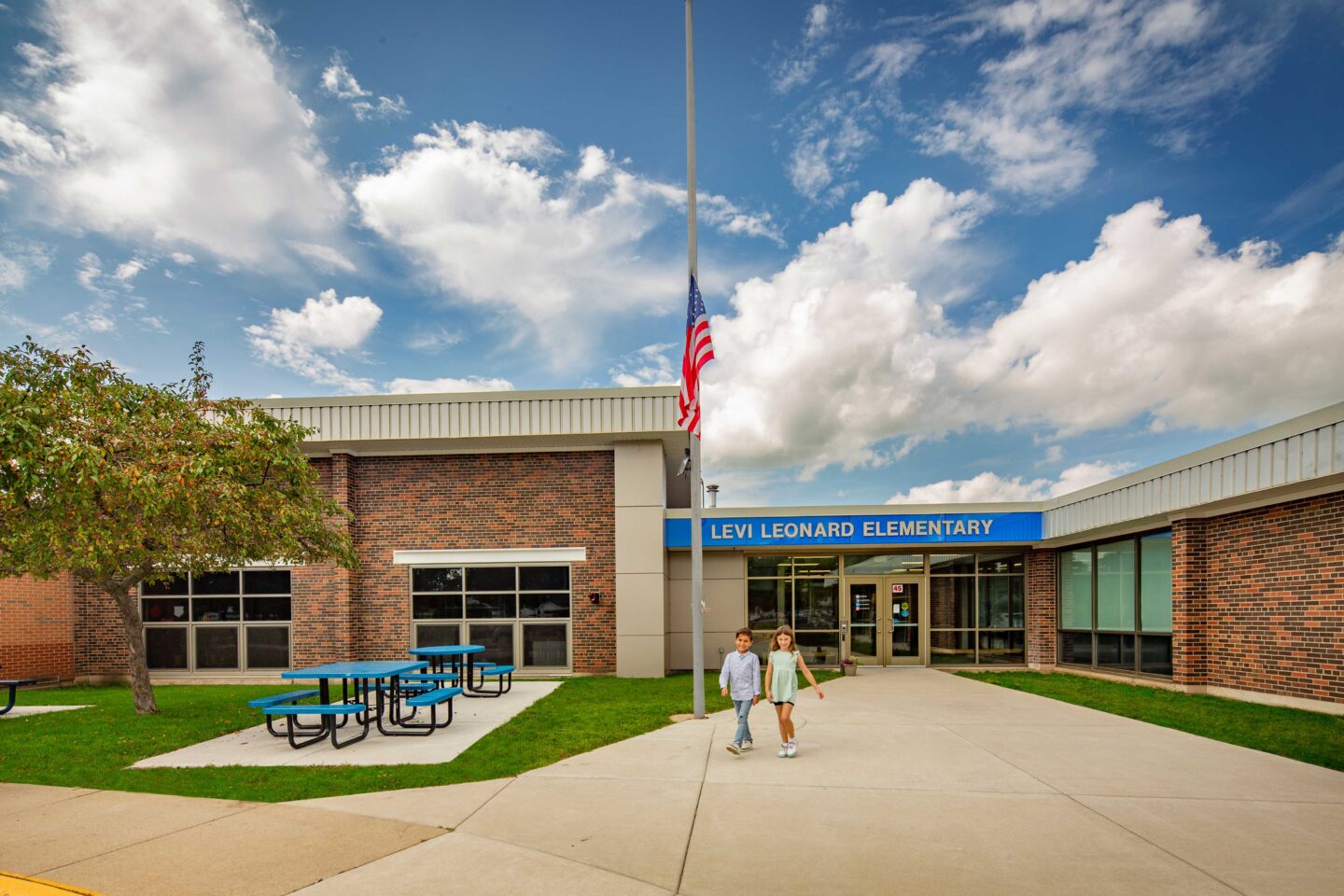 Levi Leonard Elementary School Main Entrance with students walking out of school