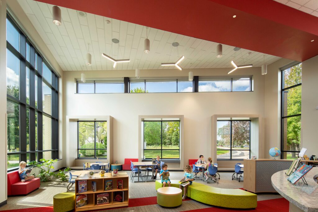 Community Elementary School library with students reading