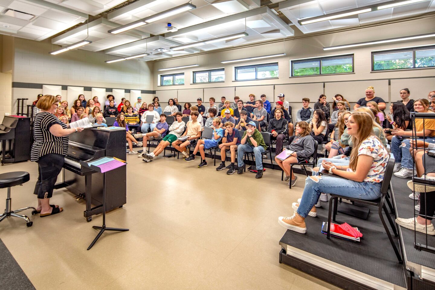 Edgerton High School Choir Room with a teacher directing students to sing