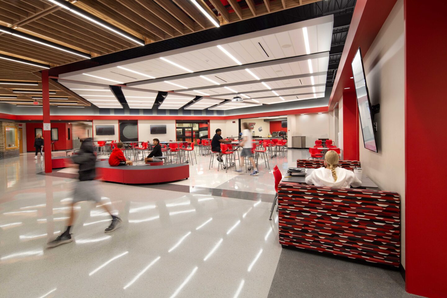 Edgerton High School Commons Area with students walking and talking