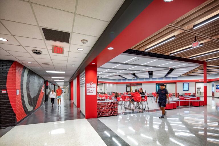 Edgerton High School Commons Area with view into the gym corridor and students walking