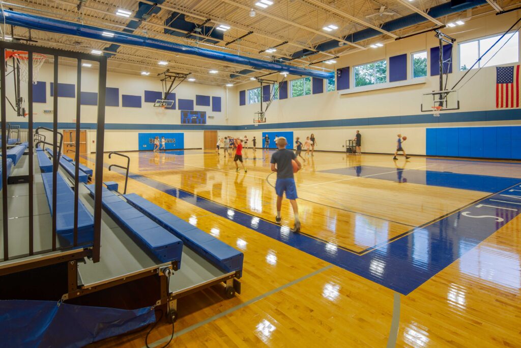 JC McKenna Middle School Gymnasium with students playing basketball