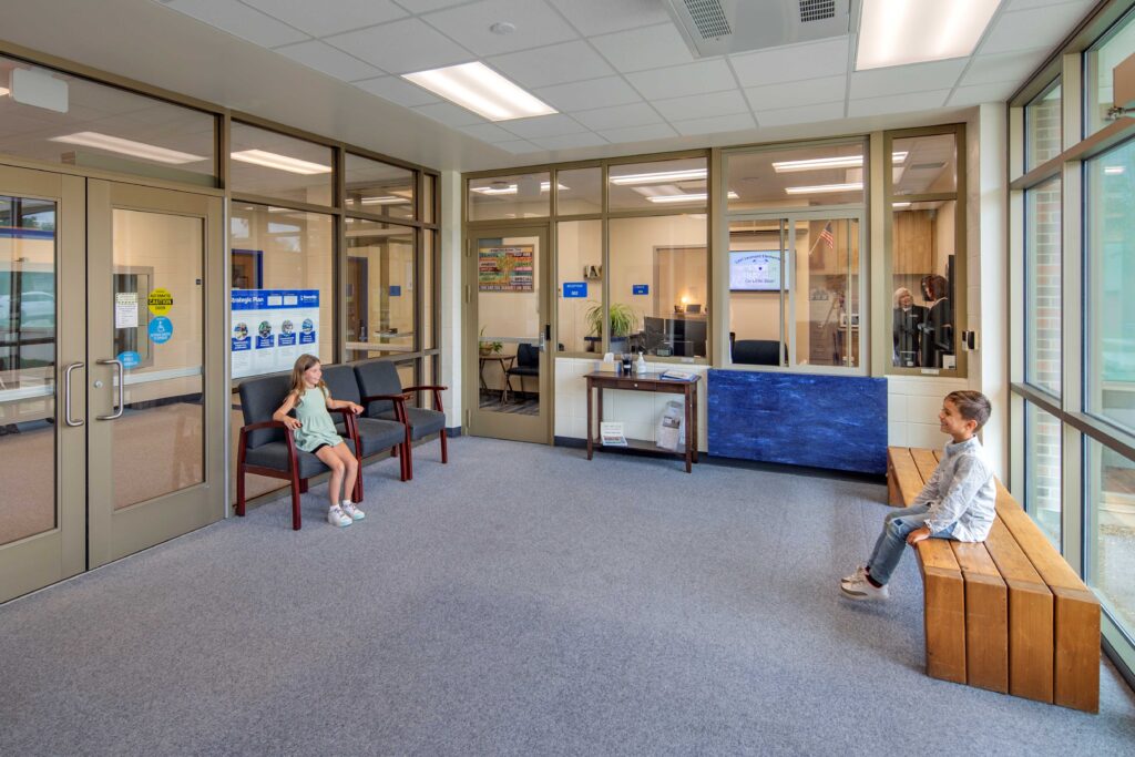 Levi Leonard Elementary School vestibule with student sitting in the chairs