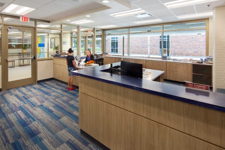 Theodore Robinson Intermediate School Main Office with secretary and student talking at the desk