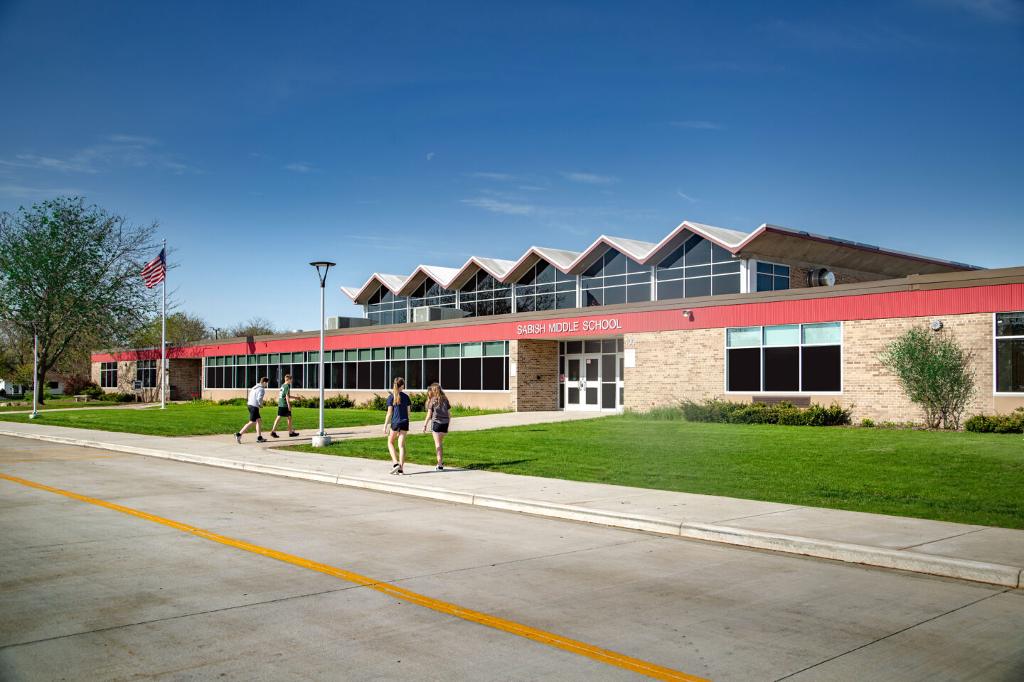 Main entrance with students walking into school