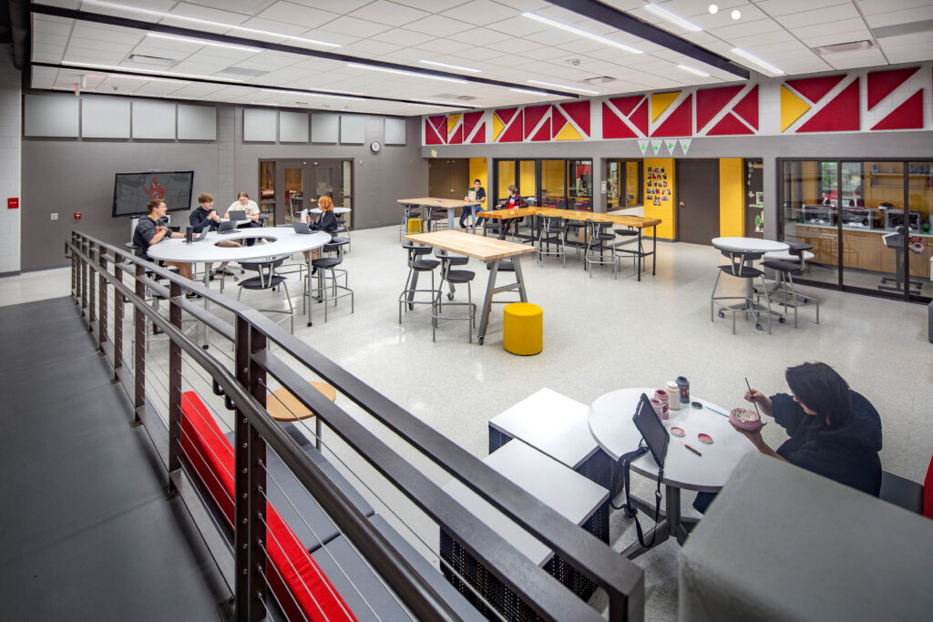 Learning stairs that connects the upper and lower commons with a ramp. Sliding glass doors allow the 3D room to be seen.