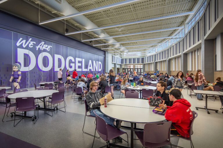 Curved, high-ceiling cafeteria and commons space for the Dodgeland School District