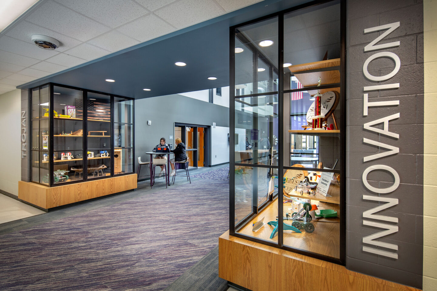 Passageway connecting two spaces with "innovation" lettering on the wall for Dodgeland School District