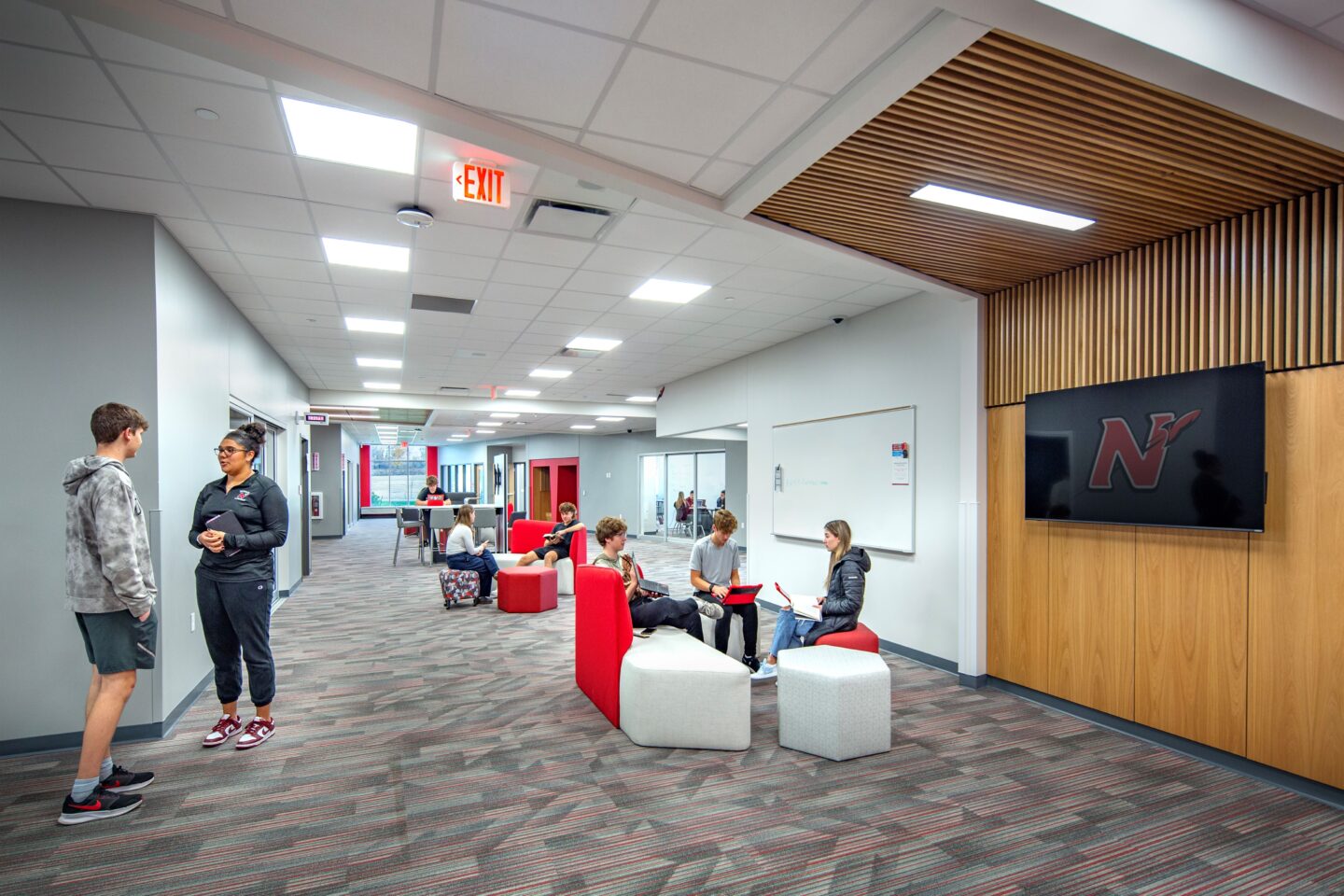 Collaboration area at Neenah High School with students working and studying together on the flexible furniture