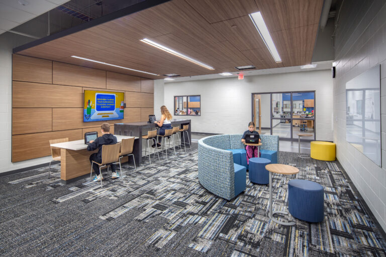 Collaboration workstation in the academic wing at Vel Phillips Middle School with a monitor and whiteboard