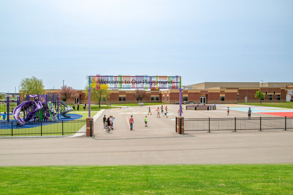 Playground area with bright colorful colors, including archway at Dodgeland School District