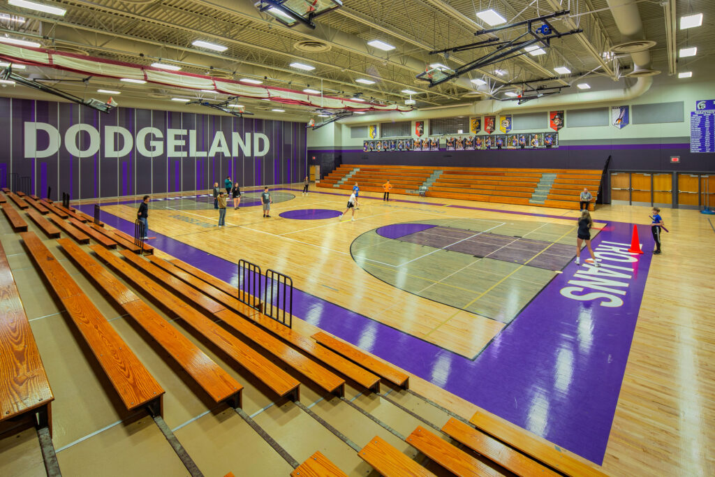 High school gymnasium with branded wall at Dodgeland School District