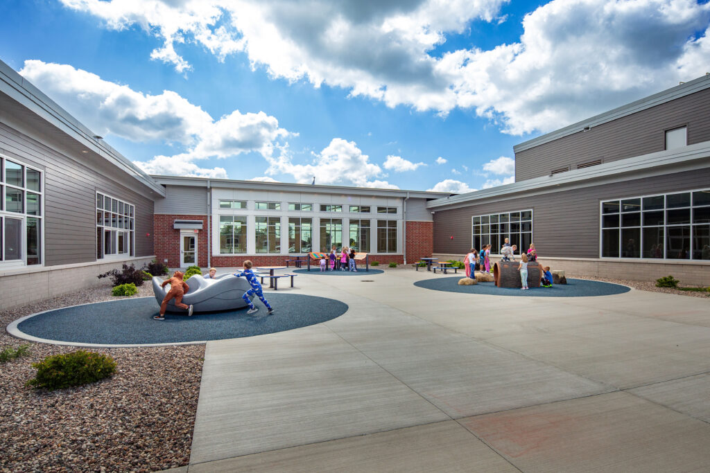 Wrightstown elementary school courtyard with students playing