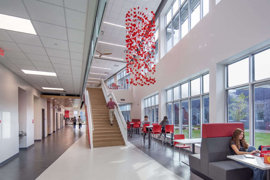 Distributed dining with a staircase and various students for students to have a snack and/or study