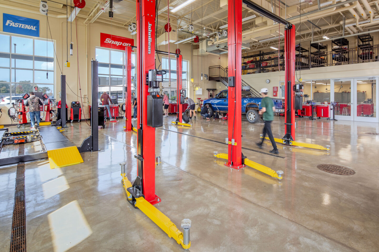 Seymour automobile shop with a mezzanine area and students working on a truck