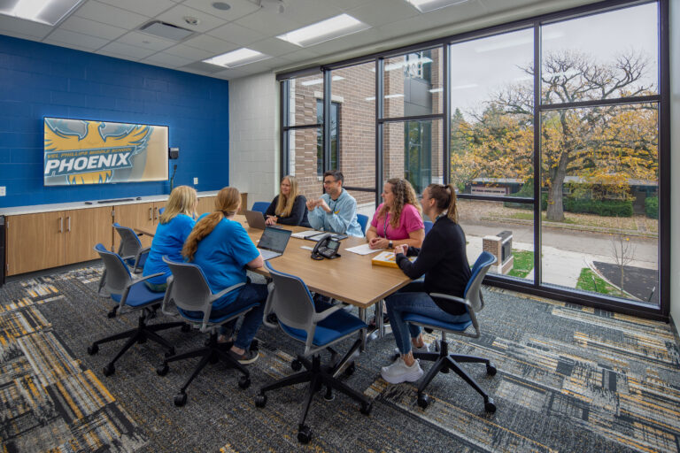 Conference room with teachers holding a meeting at Vel Phillips Middle School