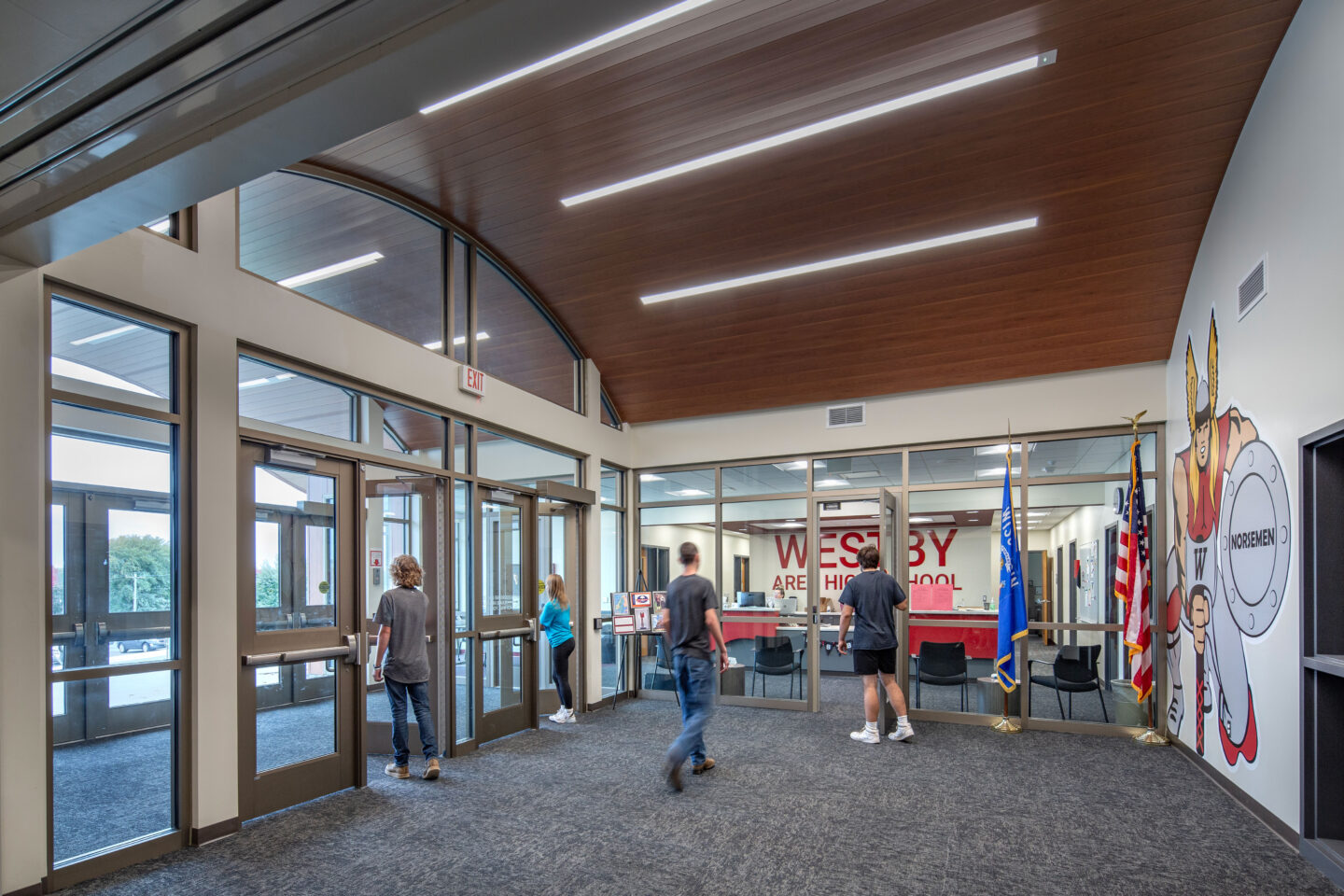 The lobby space with branding on the wall to the right and