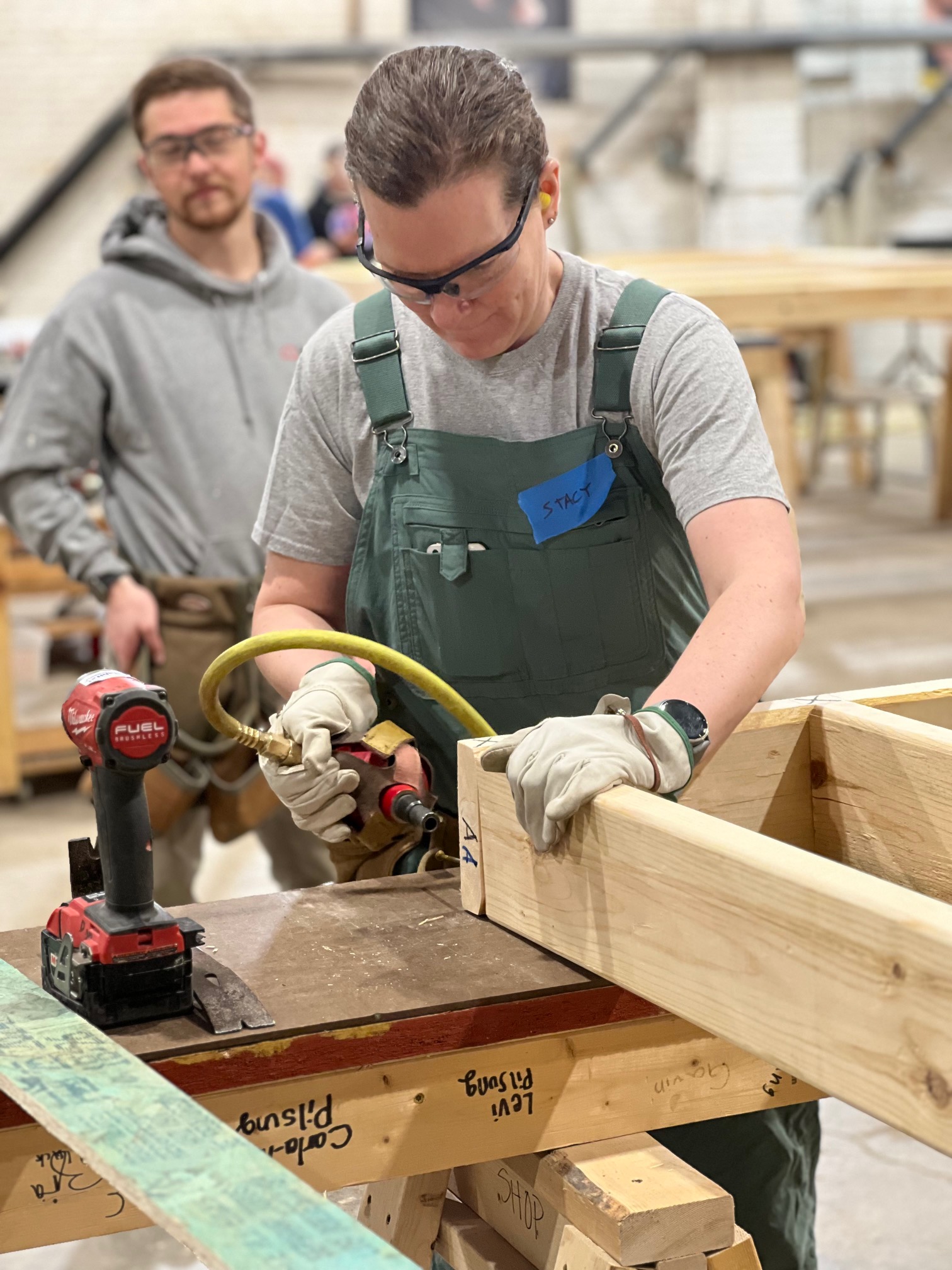 Bray employee drilling into wood at volunteer day