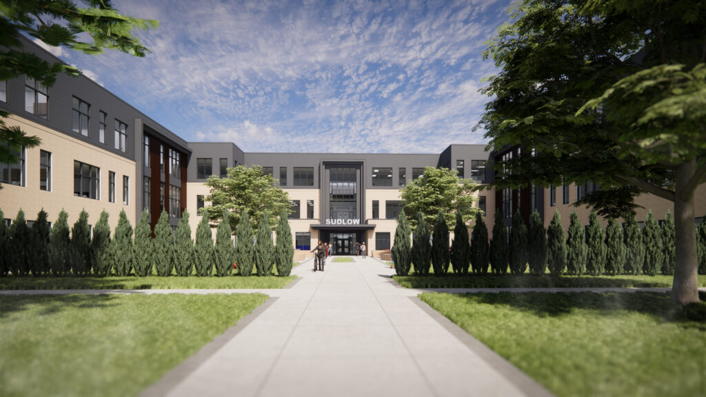 Walkway to the entrance doors with landscaping on the sides